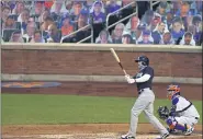  ?? ADAM HUNGER — THE ASSOCIATED PRESS ?? The Yankees’ Clint Frazier, left, watches his two-run home run against the Mets during an exhibition game July 18 in New York.