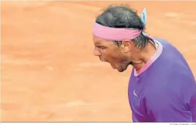  ?? ETTORE FERRARI / EFE ?? Rafael Nadal festeja con rabia un punto en su partido ante Novak Djokovic.