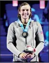  ?? (AP) ?? Katie Ledecky smiles at the medal ceremony after winning the women’s 1500 freestyle during wave 2 of the U.S. Olympic Swim Trials on June 16, in Omaha, Neb.