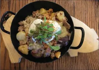  ?? ALANA HUDSON, SPECIAL TO THE HAMILTON SPECTATOR ?? The Ploughman’s Hash was loaded with fresh, local ingredient­s.