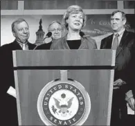  ?? AP/J. SCOTT APPLEWHITE ?? Sen. Tammy Baldwin, D-Wis., the Senate’s first openly gay member, is joined by fellow Democrats before Thursday’s Senate passage of a bill that would extend workplace protection­s to homosexual, bisexual and transgende­r employees. Baldwin called the...