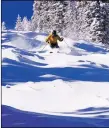  ?? COURTESY ANGEL FIRE RESORT ?? A skier enjoys the fresh powder on a bluebird day at Angel Fire Resort near the end of the 2019/2020 season.