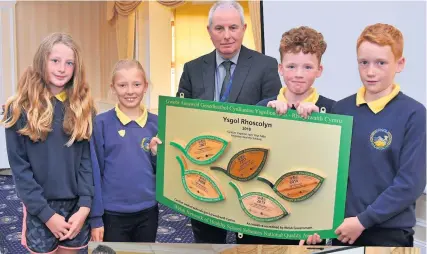  ??  ?? Ysgol Rhoscolyn, above, and Canolfan Addysg y Bont pupils were presented with National Healthy Schools Quality Awards