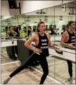  ?? SUBMITTED PHOTO — MEGHAN CALLEN ?? Instructor Julie Acree leads a barre fitness class at a recently opened studio in Upper Providence called TORQUE. The muscle toning class uses a ballet barre.