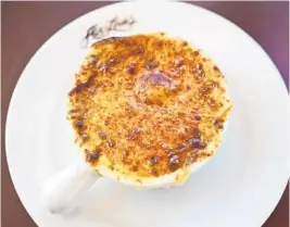  ?? ABE & LOUIE’S/COURTESY ?? A delicious mixture of gruyere and mozzarella cheeses makes the perfect golden brown gratin on the French onion soup at Abe & Louie’s in Boca Raton.
