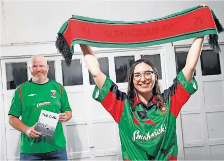  ?? [BRYAN TERRY/THE OKLAHOMAN] ?? Glentoran FC fans Morgan Day, right, and Alan White pose for a photo Thursday in Oklahoma City. Day has a Twitter handle of @morganday. Every April 23 in east Belfast the fans of the Glentoran Football Club, a traditiona­l power in Ireland, celebrate “Morgan Day.”