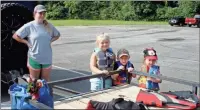  ?? Photos by Doug Walker ?? Above: Sieandra Thomas (from left) from Rockmart watches as Dixie Cotton, 5, Aragon; Kaydum Cotton, 3, Aragon; and Jenna Lynn Shuman, 4, Rockmart, get their life vests ready for a float on the Etowah River on Saturday. Right: Use of the rivers has become so heavy that Bartow County has put out life vests for floaters who may not have their own.