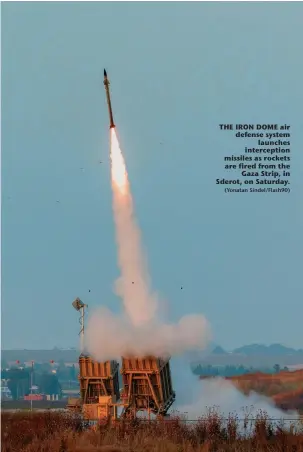  ?? (Yonatan Sindel/Flash90) ?? THE IRON DOME air defense system launches intercepti­on missiles as rockets are fired from the Gaza Strip, in Sderot, on Saturday.