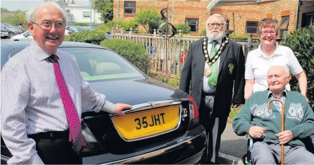  ??  ?? Councillor Jeff Tildesley with his car and the number plate sporting his initials. He purchased the number plate more than 50 years ago from Jack Godwyn, pictured in wheelchair. Jeff bumped into Jack, 93, by chance while visiting Morgana Care Home in...