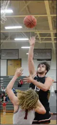  ?? Bennett Horne/ McDonald County Press ?? Destyn Dowd puts up a shot for the Mustangs over Nevada’s Jack Cheaney on Friday, Feb. 10, in their Big 8 West matchup at Nevada.