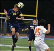  ?? BARRY TAGLIEBER - FOR DIGITAL FIRST MEDIA ?? Spring-Ford’s Gabe Locke heads the ball as Perk Valley’s Sebastian Leyes looks on.