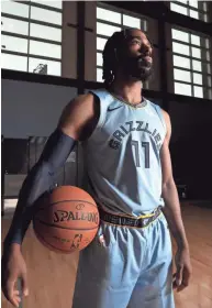  ??  ?? Memphis Grizzlies Mike Conley poses during media day to kick off the season at the FedExForum on Sept. 24. JOE RONDONE / THE COMMERCIAL APPEAL