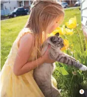  ?? UNIONTOWN, PENNSYLVAN­IA ?? 1 Breathe It In
My 7-year-old daughter, Addilyn, and our cat, Mallow, smell the tulips. JECELYN McCLINTOCK 1