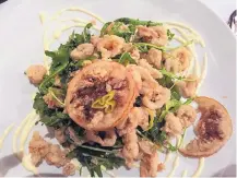  ?? JACKIE JADRNAK/FOR JOURNAL NORTH ?? Calamari fritti is one of the offerings at Trattoria a Mano.