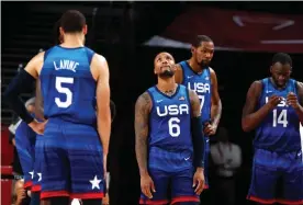  ?? Photograph: Michael Reynolds/EPA ?? Damian Lillard, Zach LaVine, Kevin Durant and Draymond Green react after losing a preliminar­y round game to France.