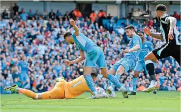  ?? (AFP) ?? Manchester City's Aymeric Laporte scores against Newcastle United in their Premier League match at the Etihad Stadium in Manchester