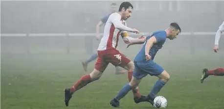  ??  ?? Whickham bring the ball clear of the hosts at Ryhope Welfare Park.