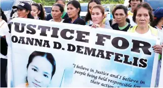  ??  ?? Residents wait for the arrival of the body of Joanna Demafelis, a Filipina domestic helper who was killed in Kuwait, in her hometown in Iloilo province in the Philippine­s on last Saturday. (Reuters)