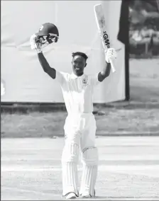  ?? ?? Guyana’s Kevlon Anderson acknowledg­es his maiden first class hundred for the West Indies Academy against Team Headley on Thursday.