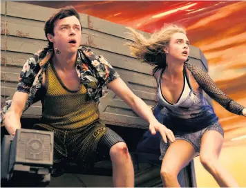  ??  ?? Spacefarin­g secret agents: Dane Dehaan and Cara Delevingne in Luc Besson’s eccentric but irresistib­le confection