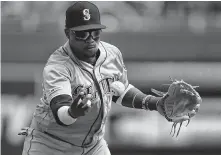  ?? Orlin Wagner / Associated Press ?? Seattle shortstop Tim Beckham makes a play during Thursday’s game. The Mariners have committed a league-worst 20 errors.