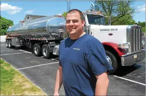  ?? PETE BANNAN – MEDIANEWS GROUP ?? Longwood Fire Chief A.J. McCarthy in front of the 8,000-gallon water tanker truck.