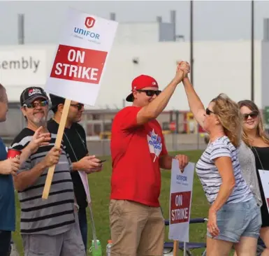  ?? DAVE CHIDLEY/THE CANADIAN PRESS FILE PHOTO ?? Last week, striking employees of the GM CAMI assembly factory in Ingersoll, Ont., were told the company plans to ramp up production at two of its cheaper Mexican operations. Under NAFTA, GM can shift production to Mexico without penalty.