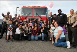  ?? Christian Monterrosa/ The Signal ?? Members of the Santa Clarita Valley community, including the sheriff’s and fire department­s, help Gregory Jones, 5, celebrate his birthday in Canyon Country on Saturday. Members of the SCV community and sheriff’s station came out to attend the birthday party for the boy who was recently diagnosed with Autism Spectrum Disorder.