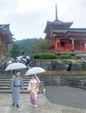  ??  ?? ● Kiyomizu Temple is known among Thai visitors as
Wat Nam Sai because the name literally means pure water temple. It is one of Kyoto’s most enduring tourist destinatio­ns. Built in 780 on a hill not far from the Otowa Waterfall, the temple has a large wooden hall complex that houses various small statues, including a statue of the highly respect Kuan Yin with a thousand arms. Behind the main hall is the Jishu Shrine, or the shrine of the deity of love. In front of the shrine are two stones, erected 18m apart. Visitors can take a challenge by closing their eyes and walking from one stone to reach to the other.
If they can do it, they will have luck in love. Before leaving the temple, many visitors tend to stop at a raised platform where they can drink holy water. Visitors can use a cup attached to a long pole and drink the fresh and cold water from a palm, not directly from the cup. They believe the holy water will bring longevity and fulfil one’s wishes.