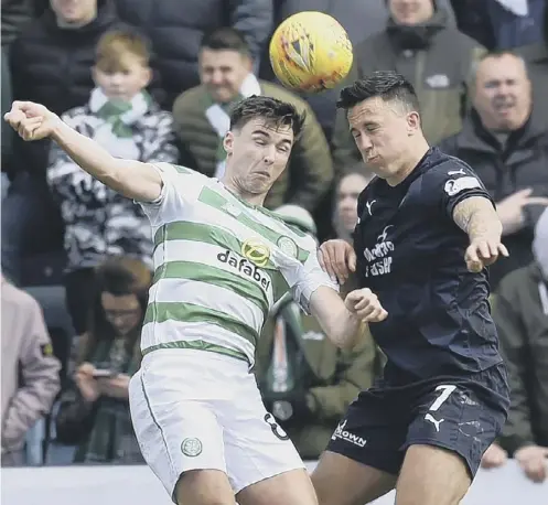  ??  ?? 0 Kieran Tierney goes head to head with John O’sullivan of Dundee during Sunday’s Ladbrokes Premiershi­p game at Dens Park.