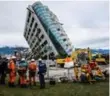  ?? ANTHONY WALLACE/AFP/GETTY IMAGES ?? Rescue workers look at the Yun Tsui building following a 6.4-magnitude quake late on Tuesday.