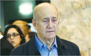  ??  ?? FORMER PRIME MINISTER Ehud Olmert leaves the courtroom at the Supreme Court in Jerusalem last December.