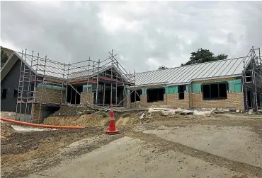  ??  ?? The new Akaroa Health Hub under constructi­on. A reader has questioned the cost of surveying residents over this developmen­t.