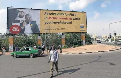  ?? Photo: Afolabi Sotunde/Reuters ?? Pay as you go: A recent South African court case revealed that the revenue service has raised red flags over MTN Nigeria’s management fee payments.