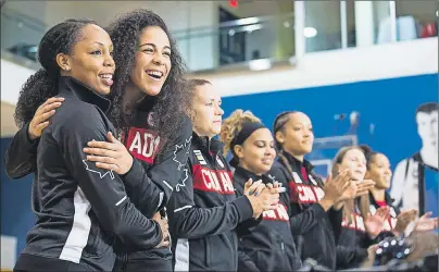  ?? CP PHOTO ?? Nirra Fields, left, and Kia Nurse embrace during a press conference Friday in Toronto announcing the 12 athletes nominated to represent Team Canada in women’s basketball for the Rio 2016 Olympic Games.