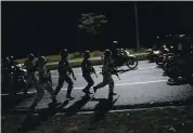  ?? MATIAS DELACROIX — THE ASSOCIATED PRESS ?? Security forces take part in a military drill Friday to mark the eighth anniversar­y of the death of President Hugo Chavez in Caracas, Venezuela.