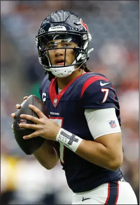  ?? MATT PATTERSON / ASSOCIATED PRESS ?? Houston Texans rookie quarterbac­k C.J. Stroud warms up before passing for 274 yards and three scores in a 45-14 wild card-round win June 13 in Houston. Stroud has not been picked off in nine straight games and has thrown nine touchdowns in that span.