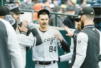  ?? DUANE BURLESON/GETTY ?? Dylan Cease is congratula­ted by teammates after pitching into the sixth inning of a game against the Detroit Tigers on Saturday. Cease has yet to lose a decision in 10 career starts against the Tigers.