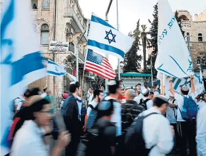  ?? THOMAS COEX/AFP/GETTY IMAGES ?? Israelis are delighted with moving the U.S. embassy from Tel Aviv to Jerusalem, while Palestinia­ns view it as a betrayal.