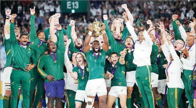  ??  ?? South African captain Siya Kolisi holds the Webb Ellis Cup aloft after South Africa defeated England to win the Rugby World Cup final at Internatio­nal Yokohama Stadium in Yokohama, Japan on Nov 2. (AP)