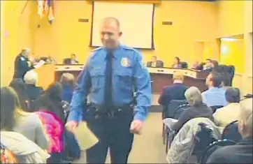  ?? City of Ferg uson ?? FERGUSON, MO., Police Officer Darren Wilson, whose shooting of an unarmed young black man has resulted in days of community unrest, is seen in a video of a City Council meeting in February.
