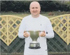  ?? ?? Seaham Town’s Mark Higgins with the County Singles trophy.