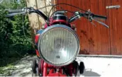  ??  ?? Above: Huge headlight is both 12V and decently bright. It has no noticeable beam however. You might be able to observe how one of the fork dampers has shed its friction plates, too
Left: Girder forks work very well, unlike the brake, which is...