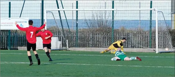  ??  ?? Kyle Howard of Greystones celebrates after opening the scoring against Arklow Celtic.