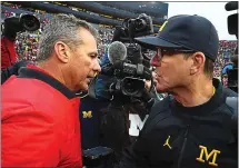  ?? GREGORY SHAMUS — GETTY IMAGES ?? Urban Meyer, left, who stepped down as Ohio State’s coach after last season, was 4-0in his meetings against Jim Harbaugh and Michigan.