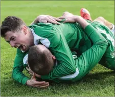  ??  ?? Mick Corrigan and Danny Browne embrace after penalties.