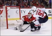  ?? REINHOLD MATAY — THE ASSOCIATED PRESS ?? Capitals center Evgeny Kuznetsov (92) scores against Panthers goaltender Sergei Bobrovsky (72) during the third period of Game 1 of a first-round playoff series Tuesday in Sunrise, Fla.