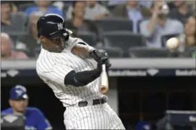  ?? BILL KOSTROUN — THE ASSOCIATED PRESS FILE ?? Andrew McCutchen hits a home run against the Blue Jays last September. McCutchen reportedly agreed to a 3-year, $50 million contract with the Phillies Tuesday.