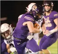  ?? (NWA Democrat-Gazette/Hank Layton) ?? Ozark running back Landon Wright scored five touchdowns in the Hillbillie­s’ 48-18 victory over Huntsville on Friday night in a Class 4A first-round playoff game. More photos are available at arkansason­line.com/1113hhsohs/