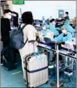  ?? Photo: HKT Quarantine ?? Tourist arrivals are processed for entry at Phuket airport on May 1.